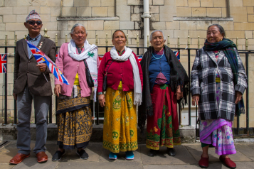 Five Gurkha Nepalese residents wearing traditional dress