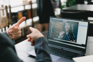 Two people using BSL to communicate online
