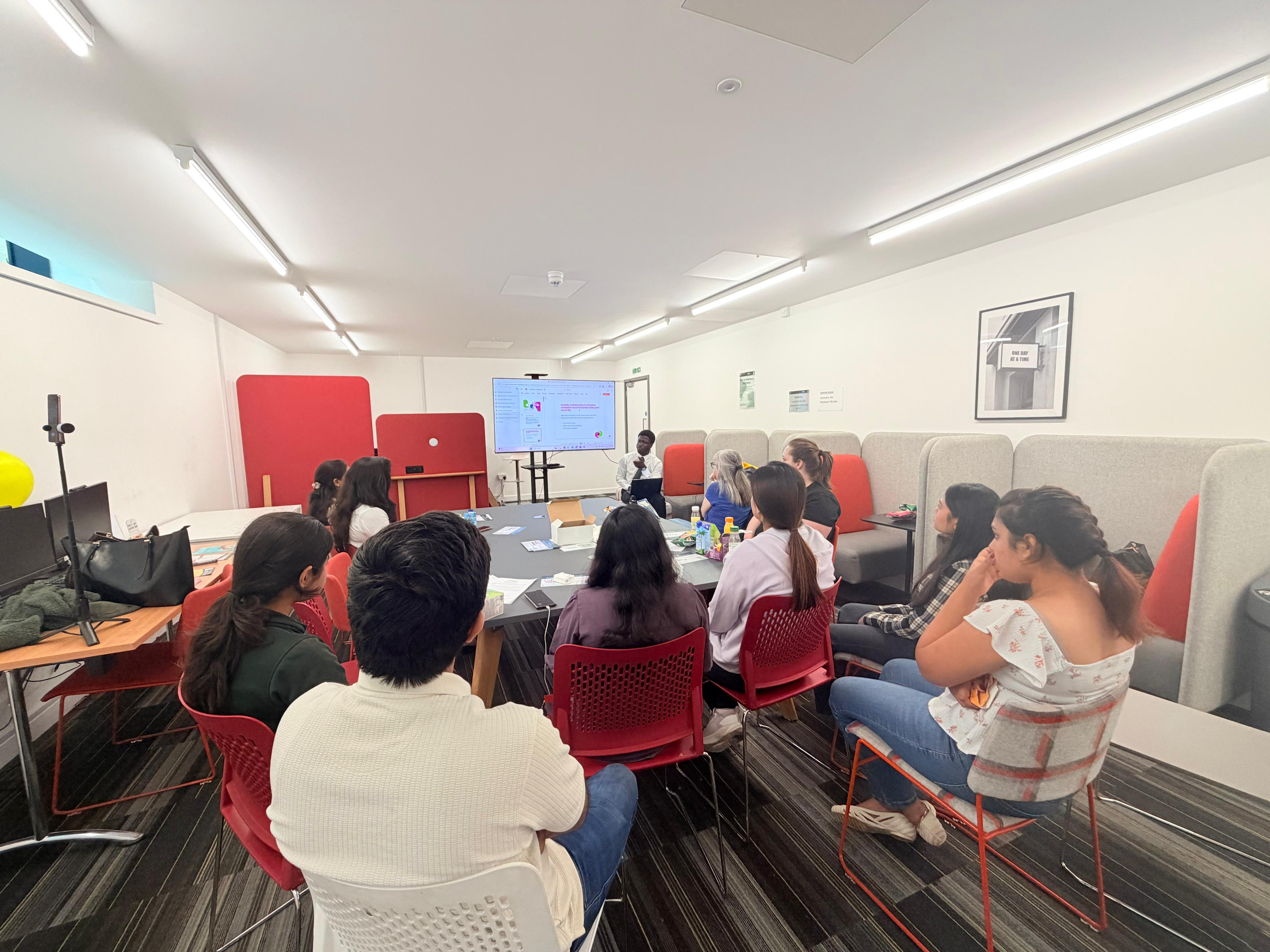 a room full of people taking training 