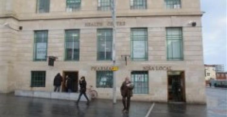 A photo of the front of Equitable House building on a rainy day