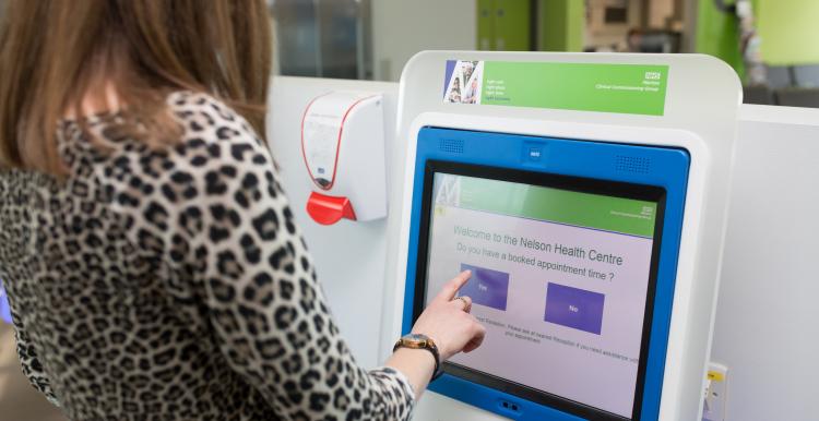 woman using a touchscreen