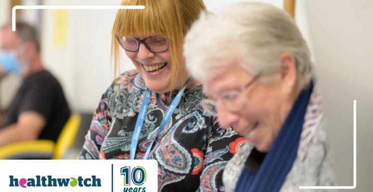 A photo of two women smiling with the Healthwatch logo and "10 years" in the bottom left corner