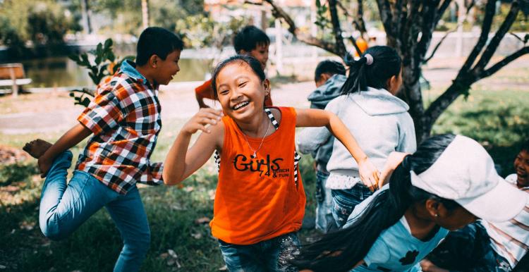 Young kids running and laughing