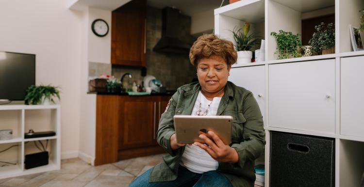 Woman on an ipad in her own home