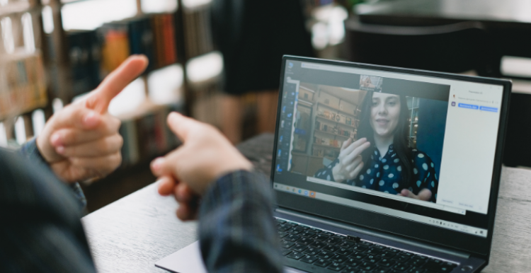 Two people using BSL to communicate online 