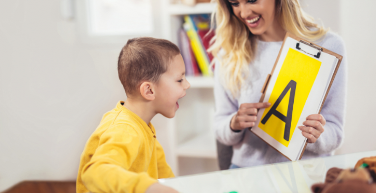 Image of child being supported by a health care professional