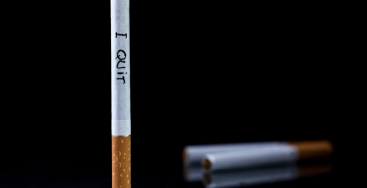 Cigarette with 'I quit' written across it