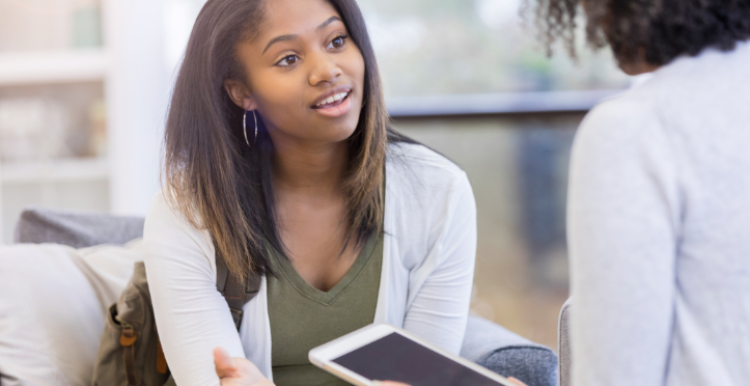 Volunteer talks to service user