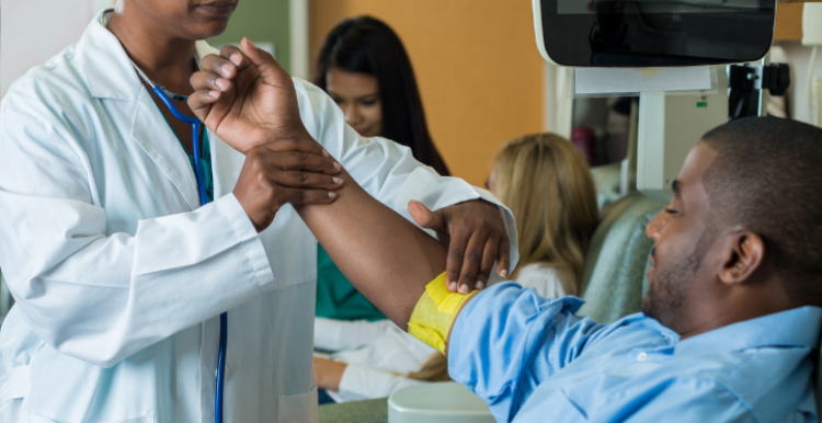 man giving blood in hospital