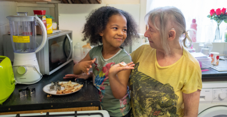 Grandmother with grandchild in the kitchen