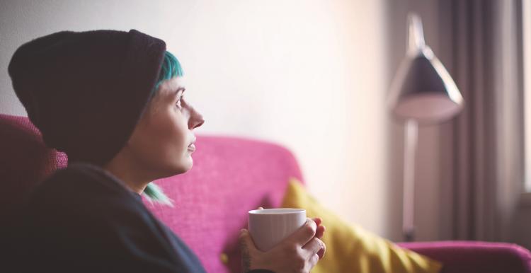 Person holding a cup of coffee