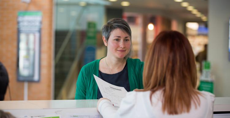 Lady at reception in a health service