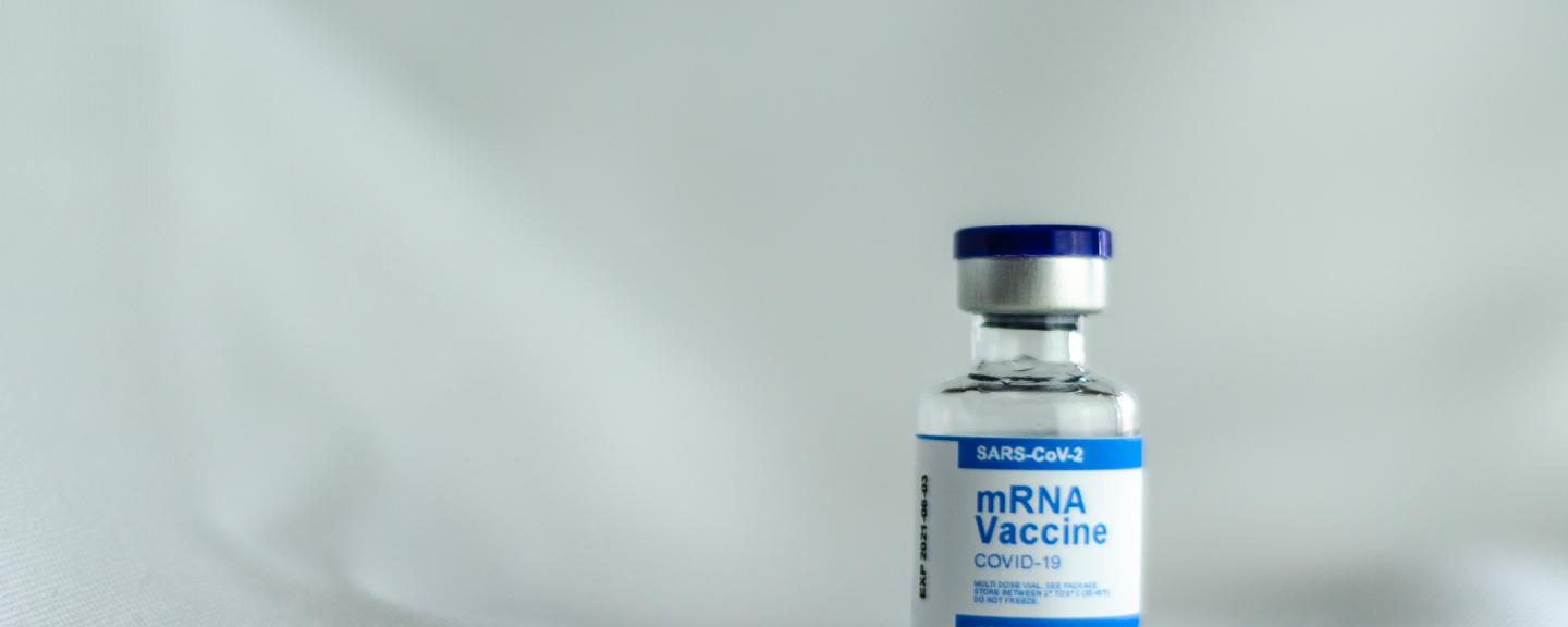 A small bottle containing the solution for COVID-19 vaccination