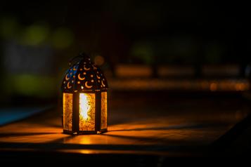 Photo of a Ramadan lantern on a table.