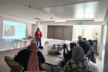 Healthwatch Greenwich representative delivering an "awareness of abuse" session with a local group supporting Muslim women.