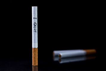 Cigarette with 'I quit' written across it