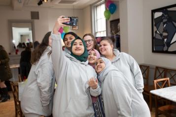 a photo of a group of teenage girls taking a selfie