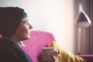 Person holding a cup of coffee