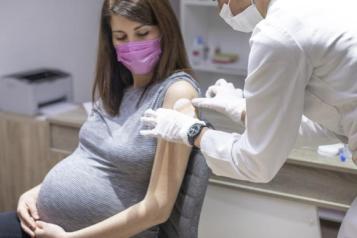 Pregnant woman being vaccinated