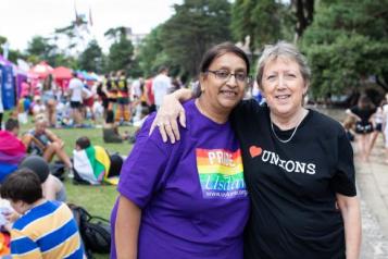  two women at pride with their arms around each other 
