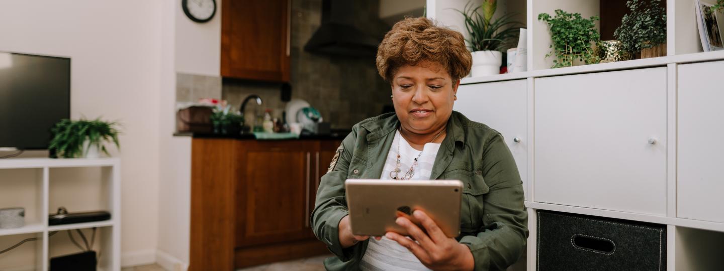 Woman using an ipad in her home