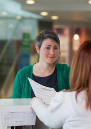 Lady at reception in a health service